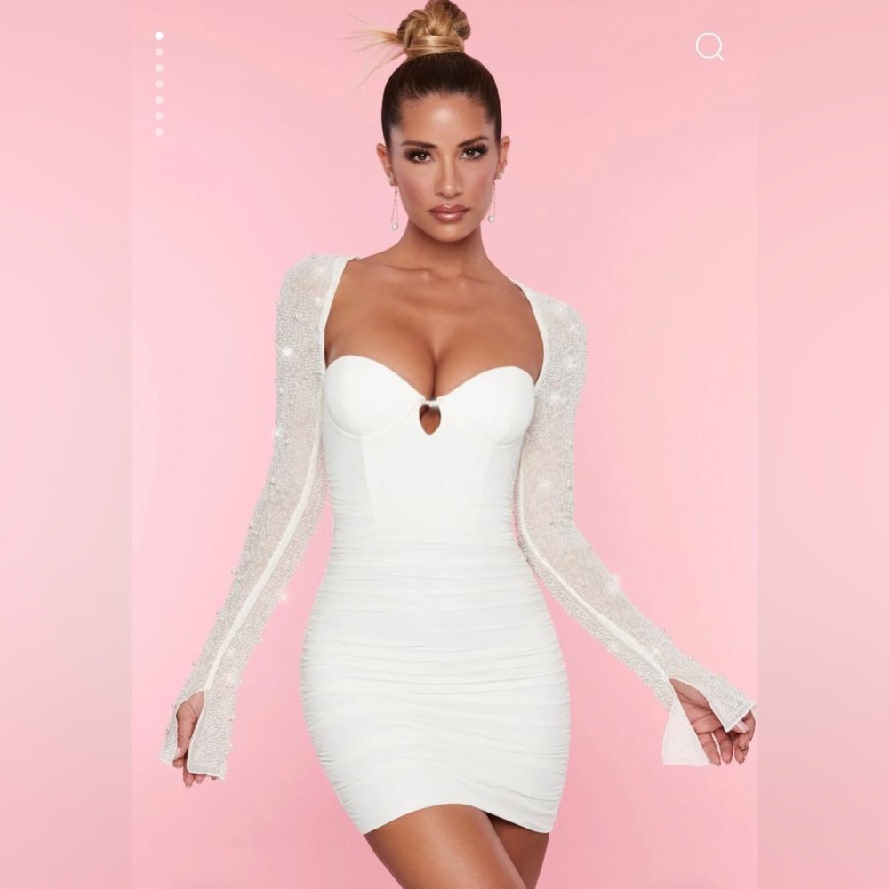 ST. GERMAIN
Embellished Long Sleeve Mini Dress in White.